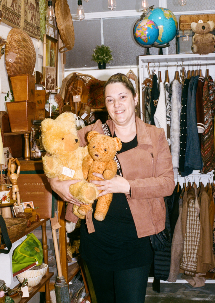 Ann-Marie Jeffries holding vintage teddy bears in the Collectable Clutter stall at My Dead Grandpa Adelaide.