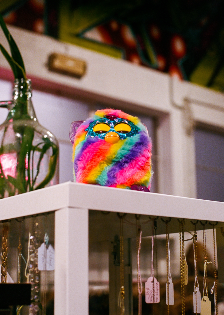 Rainbow Furby displayed with vintage jewellery and accessories at Rad.est Vintage Adelaide