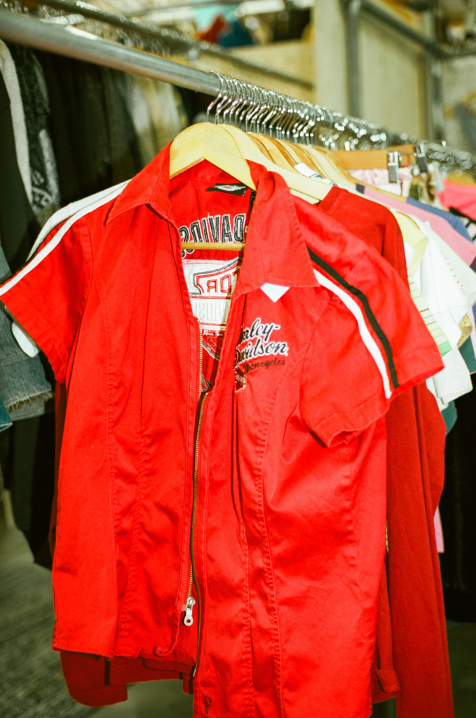 Red vintage Harley-Davidson shirt hanging on the Vintage Pizza clothing rack in Adelaide