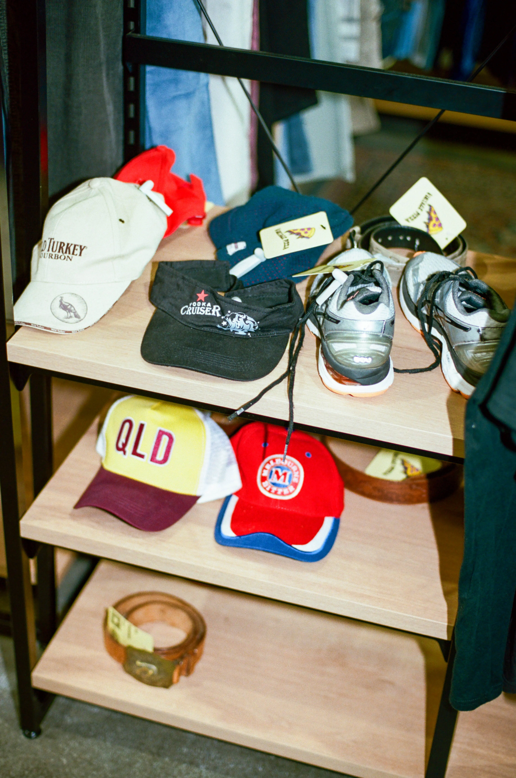 Vintage caps, sneakers and belts displayed by Vintage Pizza at My Dead Grandpa Adelaide