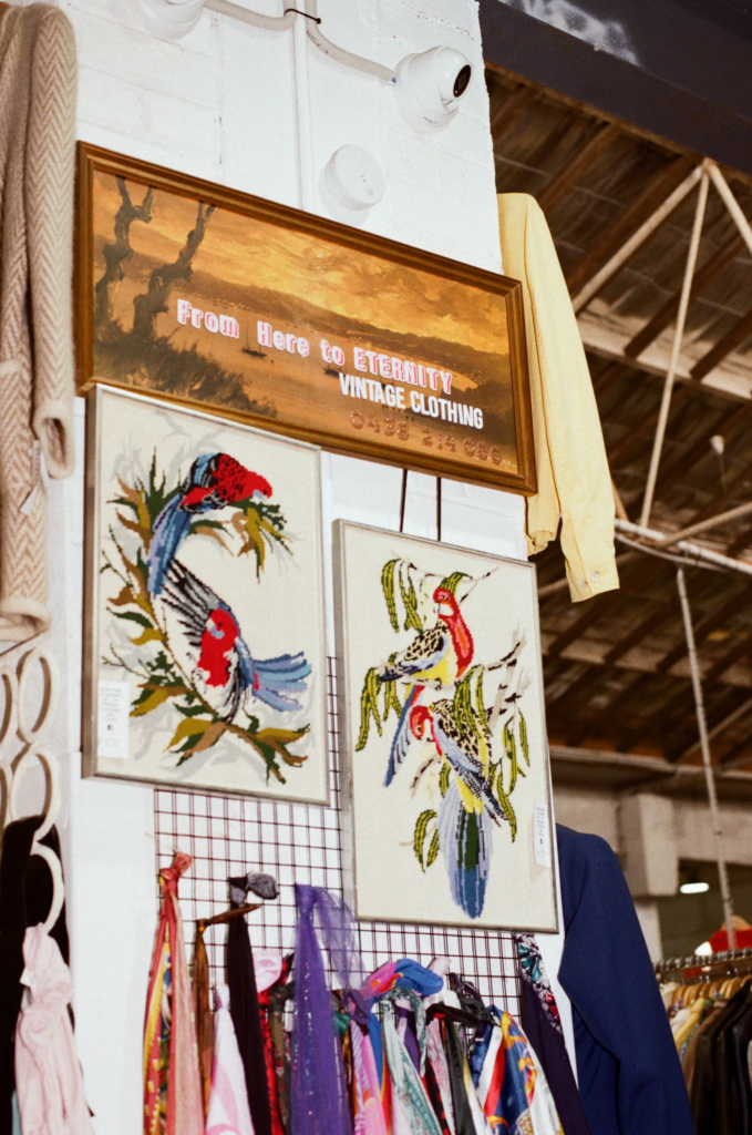 From Here to Eternity vintage clothing sign above racks of colourful vintage fashion at My Dead Grandpa Adelaide