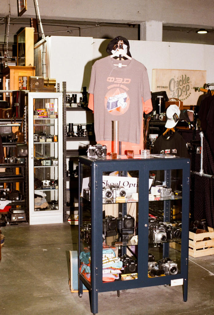 Old Skool Optics vintage camera cabinet with film cameras and photography collectibles in Adelaide.