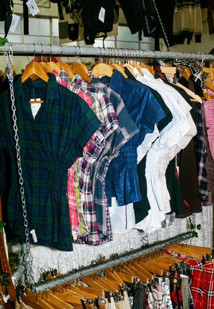 Rack of Thrifty Gal Y2K tops, plaid shirts and preloved clothing at My Dead Grandpa Adelaide.