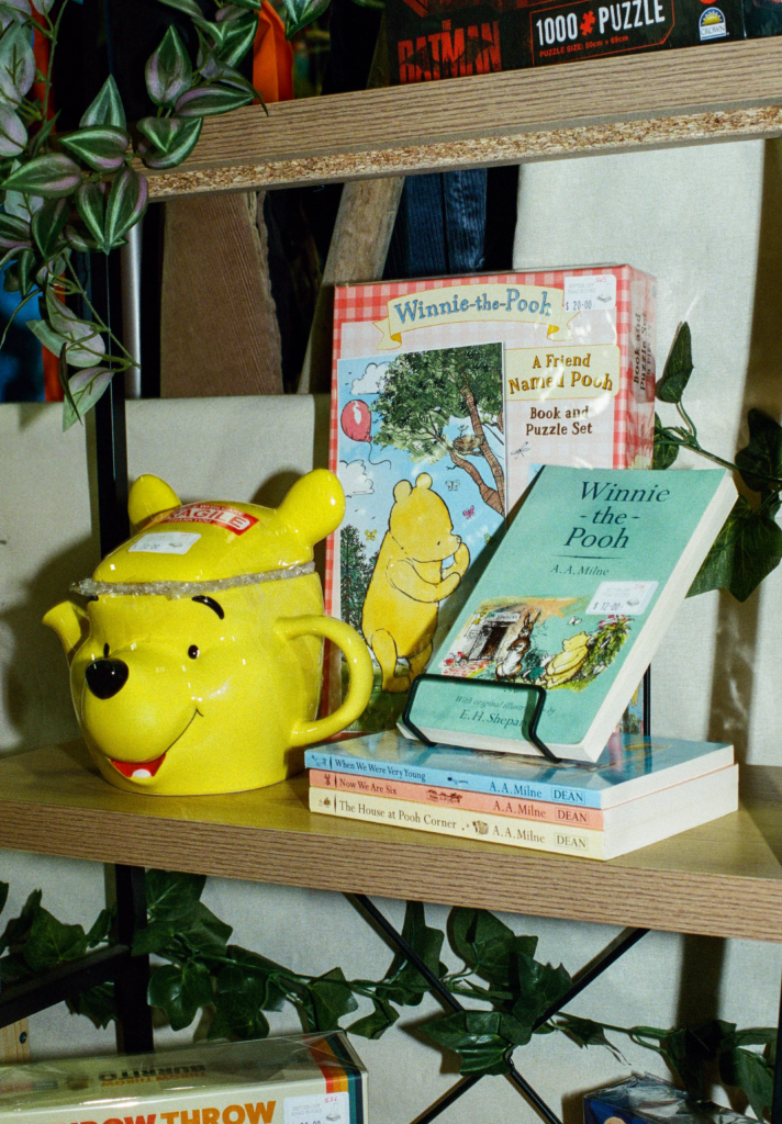 Winnie the Pooh books and yellow teapot at Better Off Read Adelaide book stall