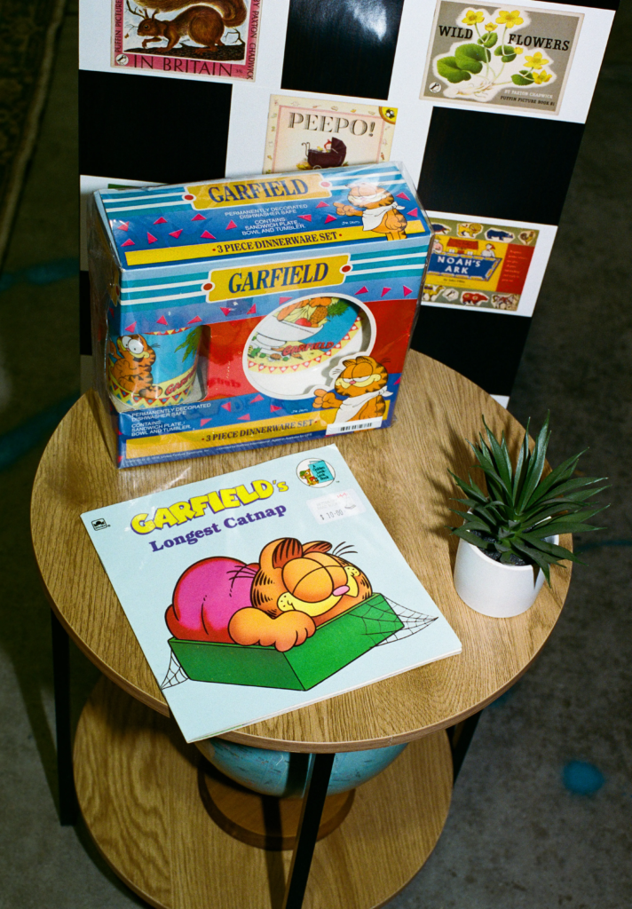 Garfield book and dinnerware set displayed by Better Off Read at My Dead Grandpa