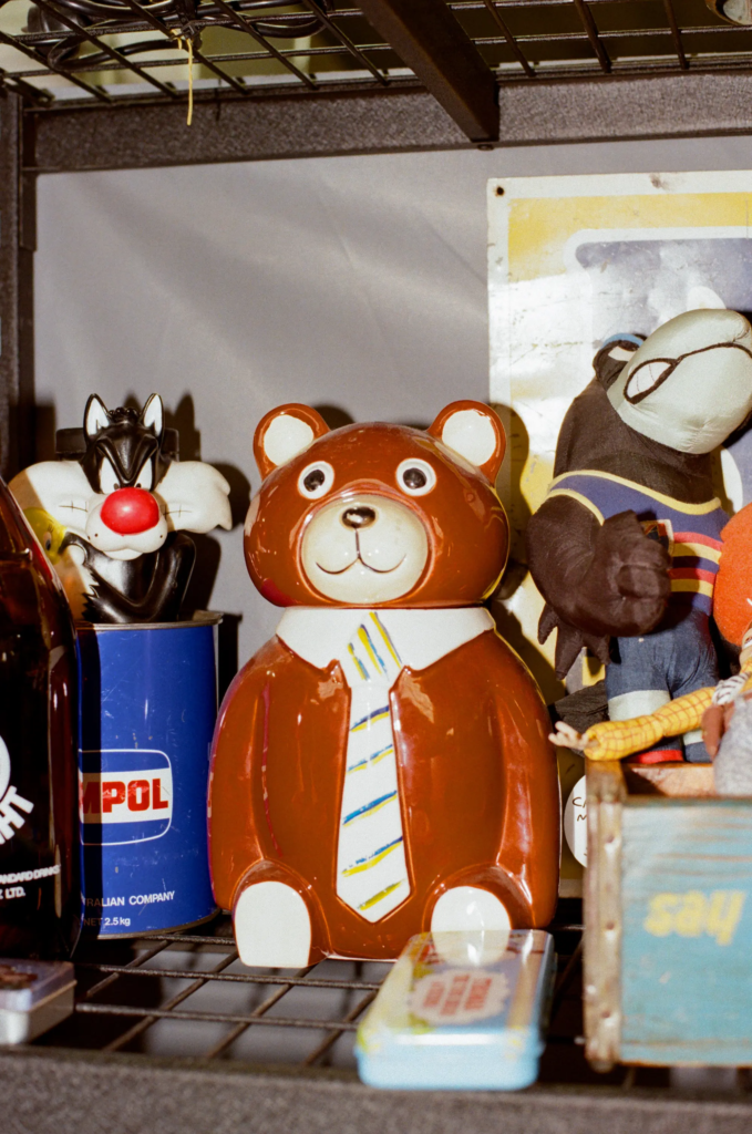 Retro toys and vintage collectibles displayed on a shelf in the Scrapdogs stall at My Dead Grandpa Adelaide