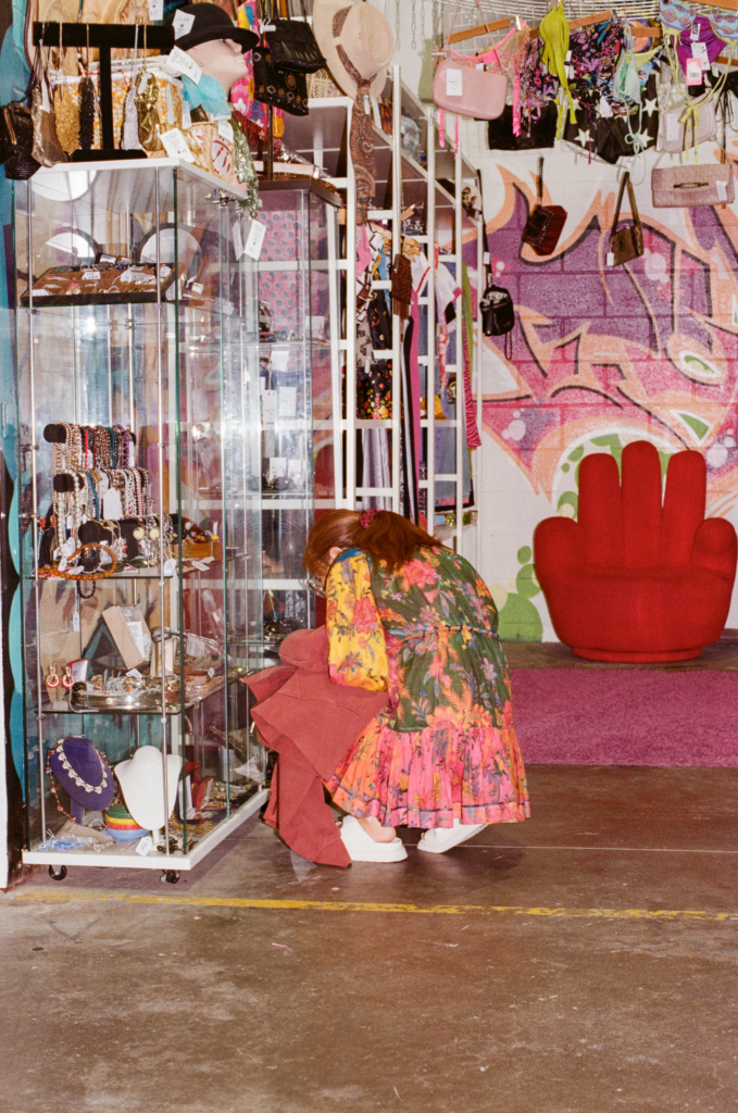 Shopper browsing Rad.est Vintage Y2K clothing and accessories at My Dead Grandpa Adelaide