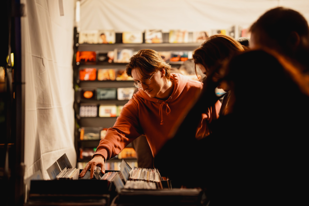 Customer browsing vinyl records at a Deadbeat Sounds pop-up record shop in Adelaide