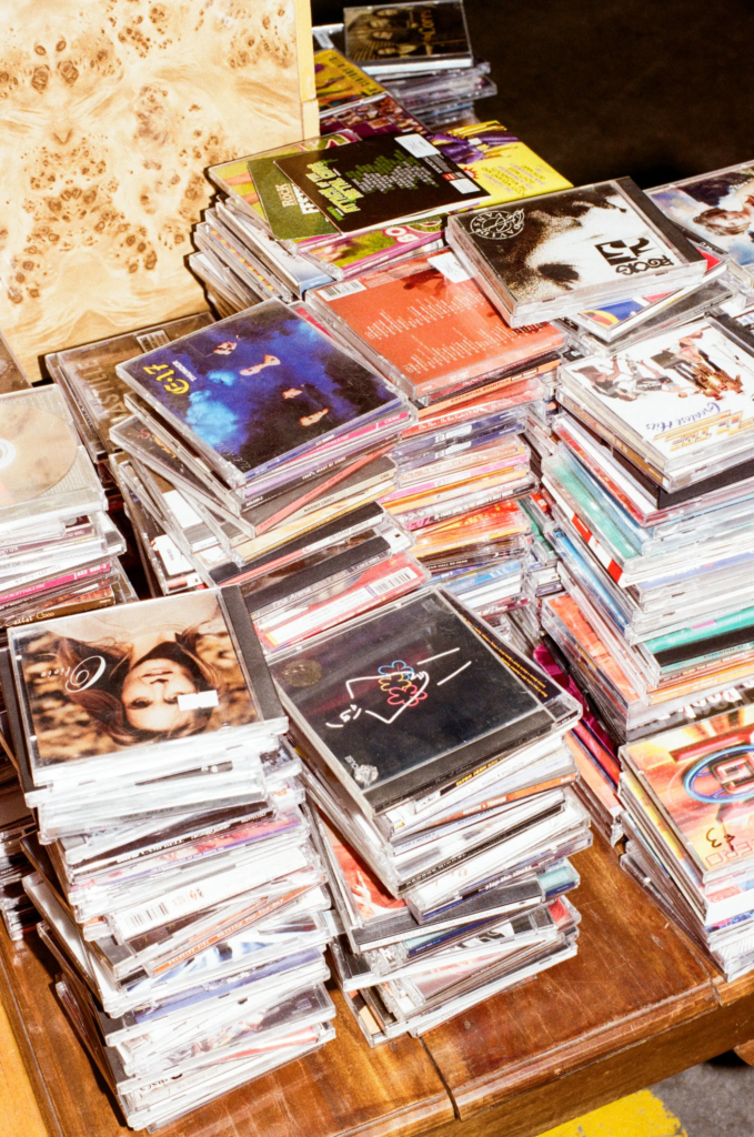 Close-up of assorted second-hand rock and pop CDs at Deadbeat Sounds Adelaide