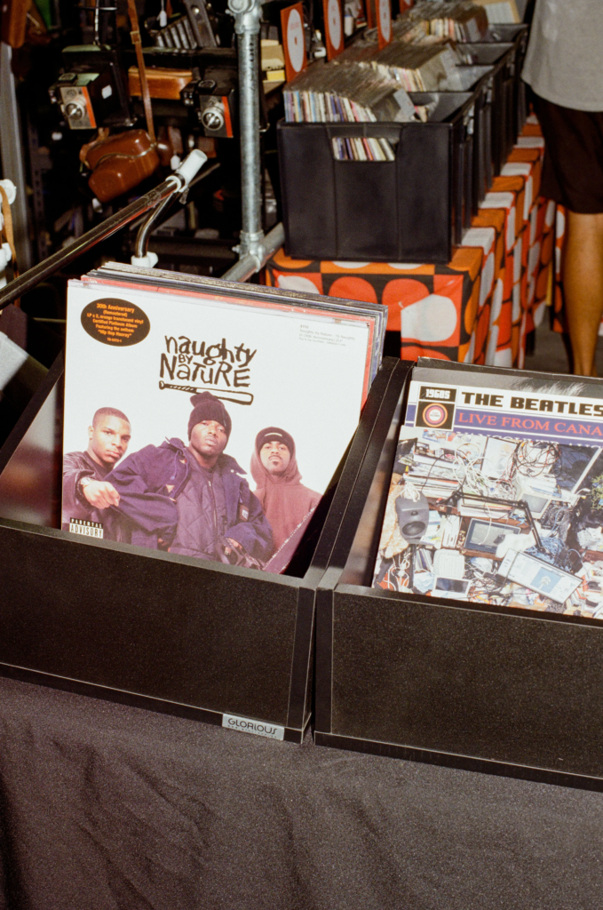 Vinyl records by Naughty by Nature and The Beatles displayed at Deadbeat Sounds in Adelaide