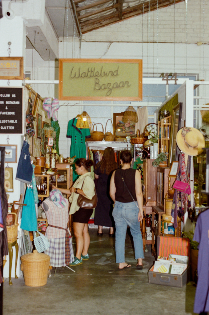 Customers browsing the Wattlebird Bazaar vintage homewares and fashion stall inside My Dead Grandpa Adelaide.