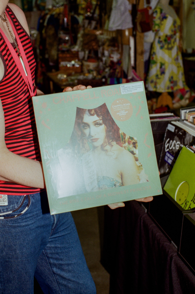 Customer holding a Chappell Roan vinyl record at Deadbeat Sounds in Adelaide