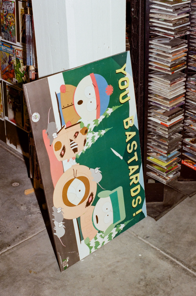 South Park poster, comic books and second hand CDs displayed in the Scrapdogs section at My Dead Grandpa