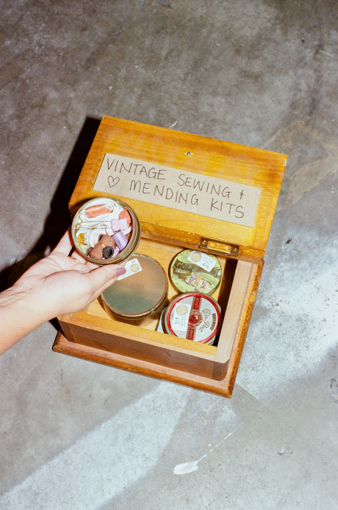 Vintage sewing and mending kits displayed in a wooden box at Wattlebird Bazaar Adelaide.